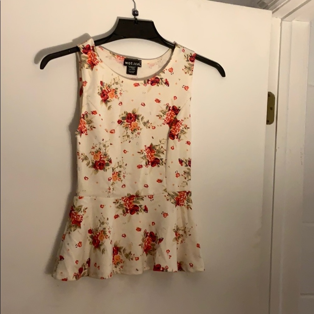 Cream colored floral peplum top